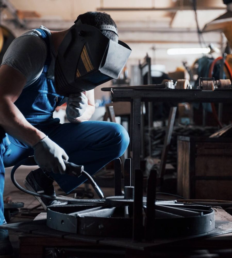 portrait-of-a-young-worker-at-a-large-metalworking-plant-the-welder-engineer-works-in-a-protective-1.jpg